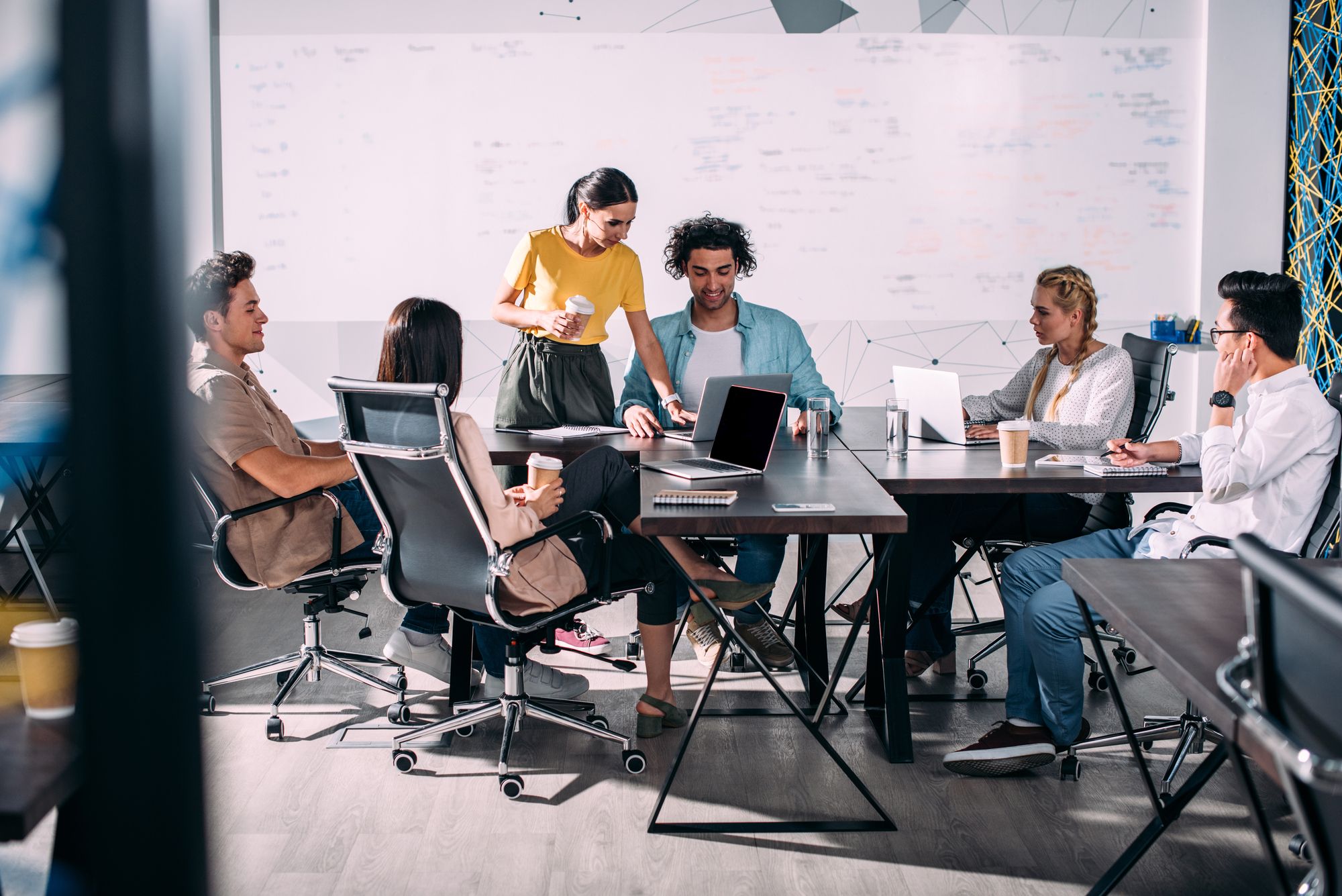 people sitting around a work table