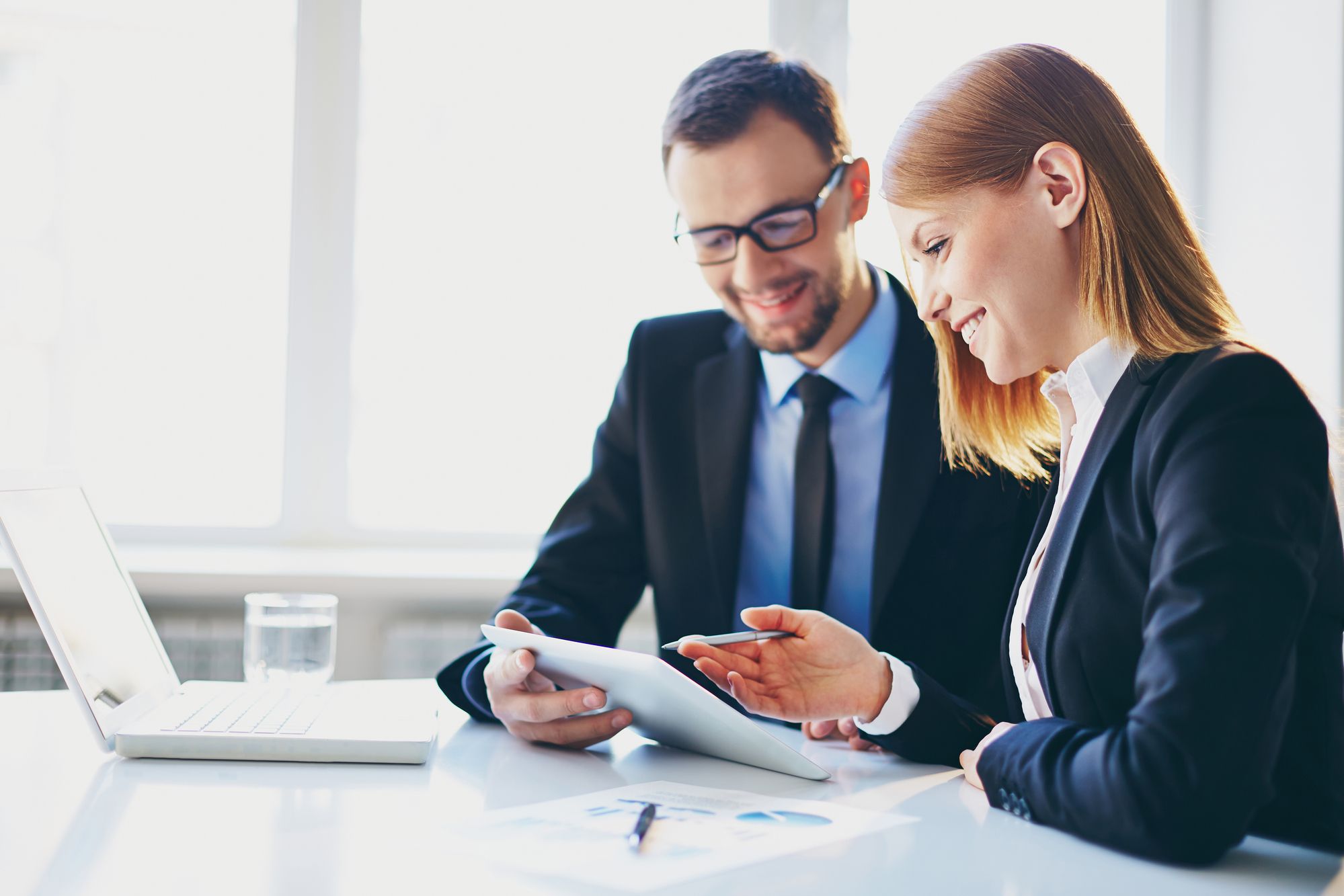 Two people going over some paperwork.