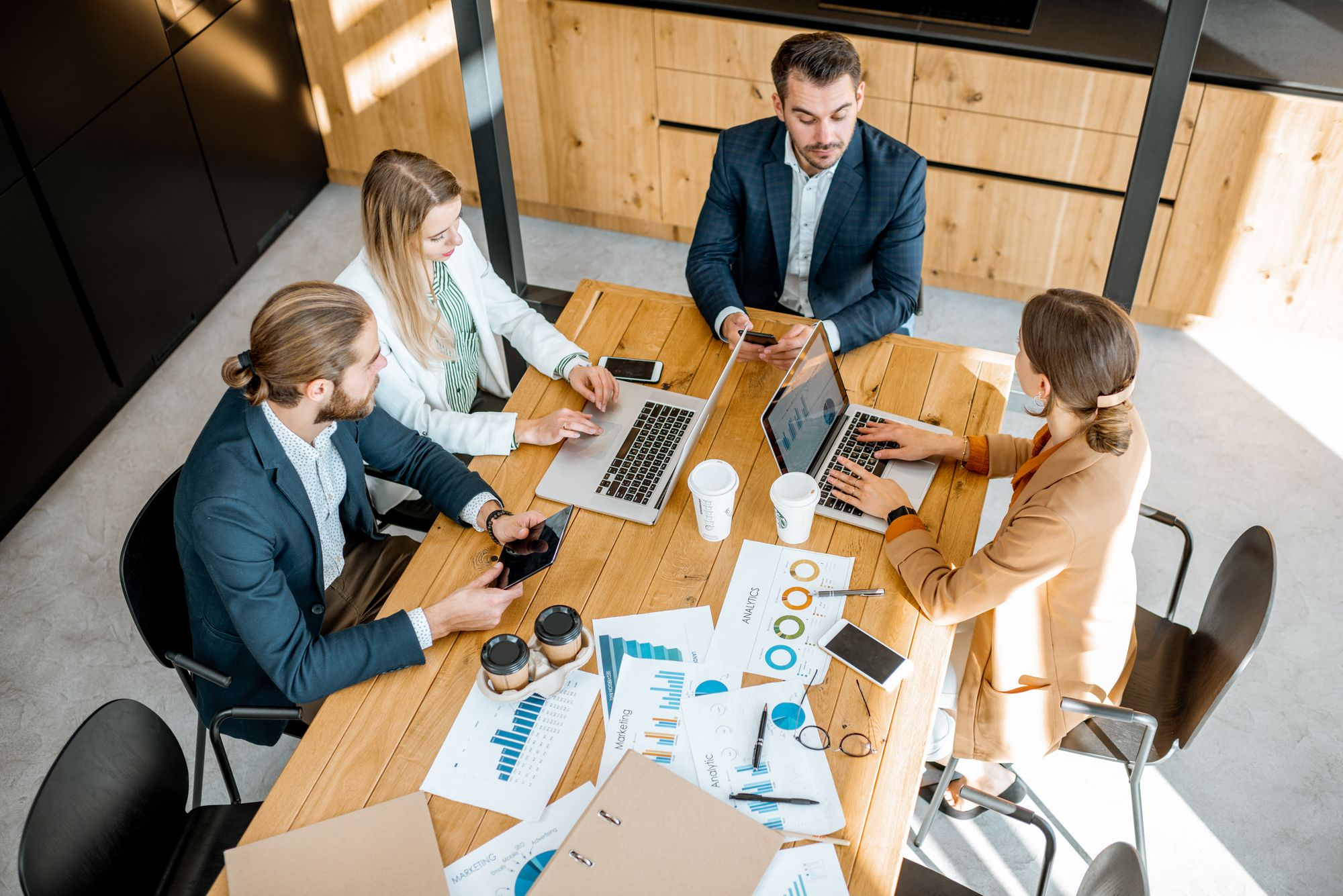 People meeting and discussing work matters.